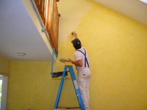 A man painting a room