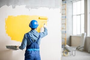 Man Painting a wall